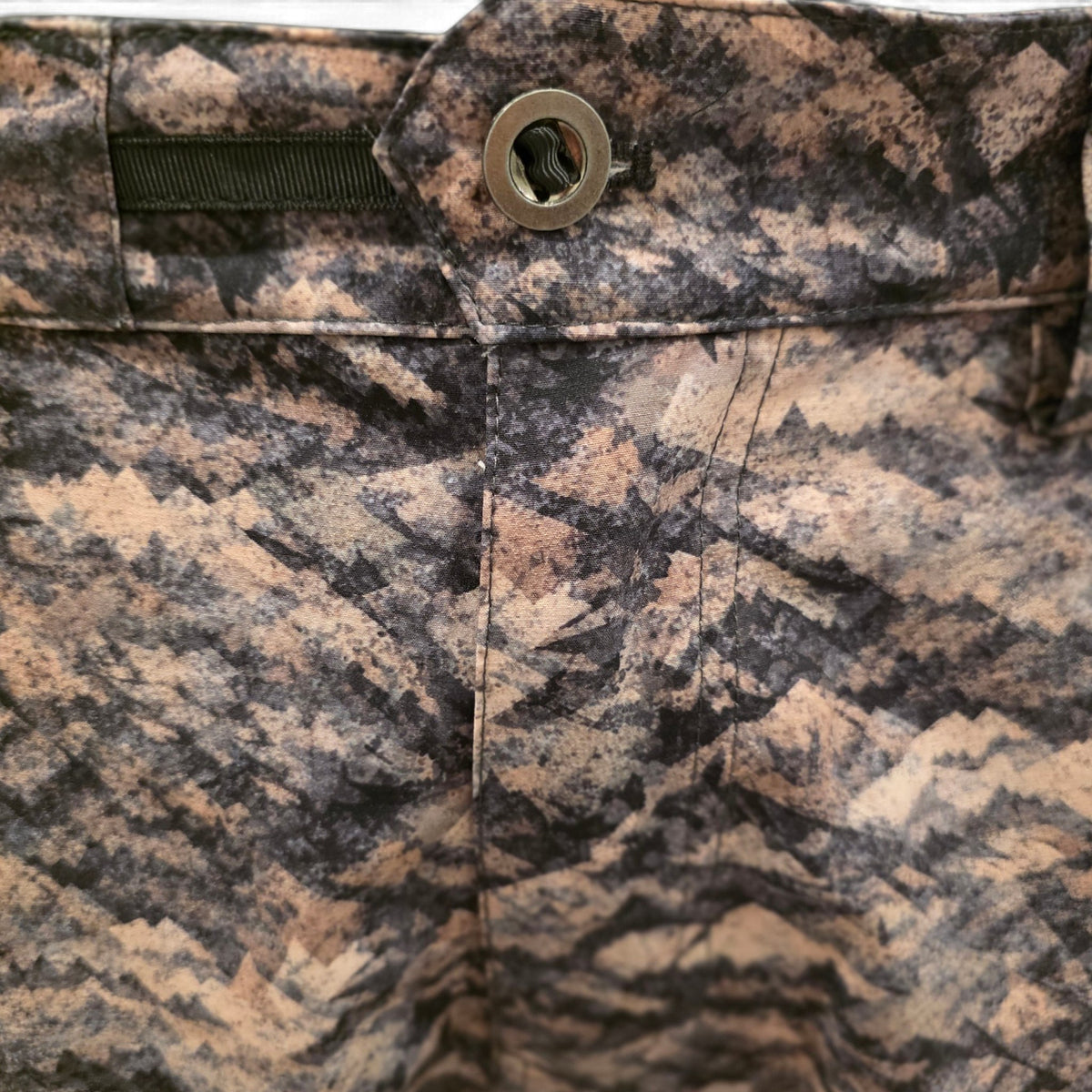 Grave Point Pant waistband and fly in Canyon Ghost camo with metal button closure
