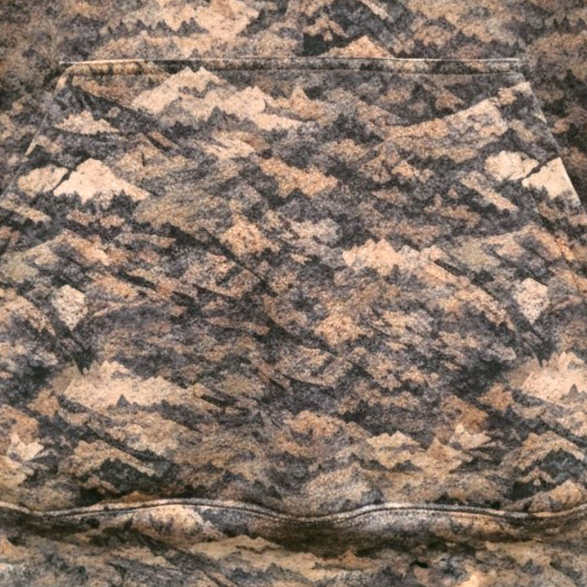 Kangaroo pocket on the Grave Point Hoody, showing the Canyon Ghost mountain camo pattern up close