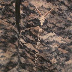 Close-up of the Seven Devils skull logo and vertical wordmark on the thigh of the Grave Point Pant